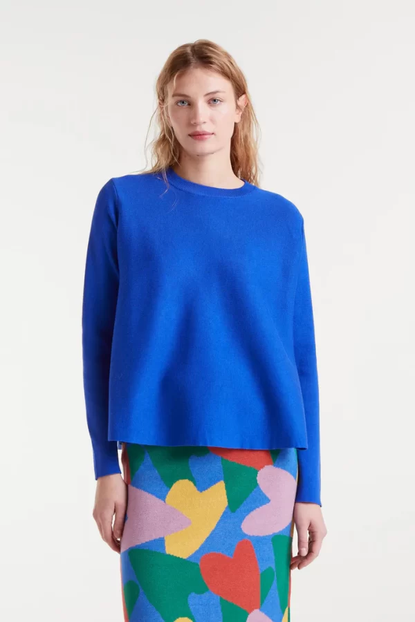 Blue flared knit sweaterBlue flared knit sweater with a round neck and long sleeves.