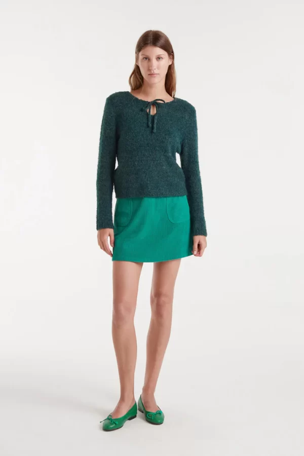 Short green corduroy skirt
